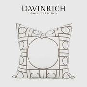 A white geometric embroidered noble cushion cover from davinrich home collection with gray outlined circles and rectangles