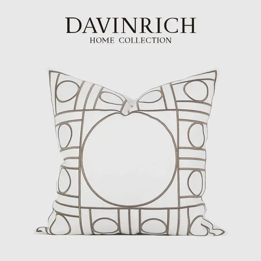A white geometric embroidered noble cushion cover from davinrich home collection with gray outlined circles and rectangles