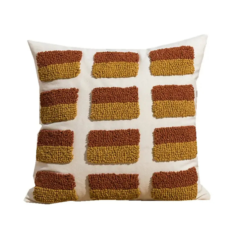 Cream-colored cushion cover with rust and mustard two-tone geometric embroidery circle patches for earthy decorbites decor