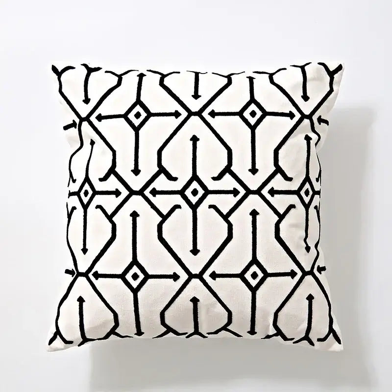 A square cushion cover with bold black geometric embroidery on off-white fabric for living room decorbites decor