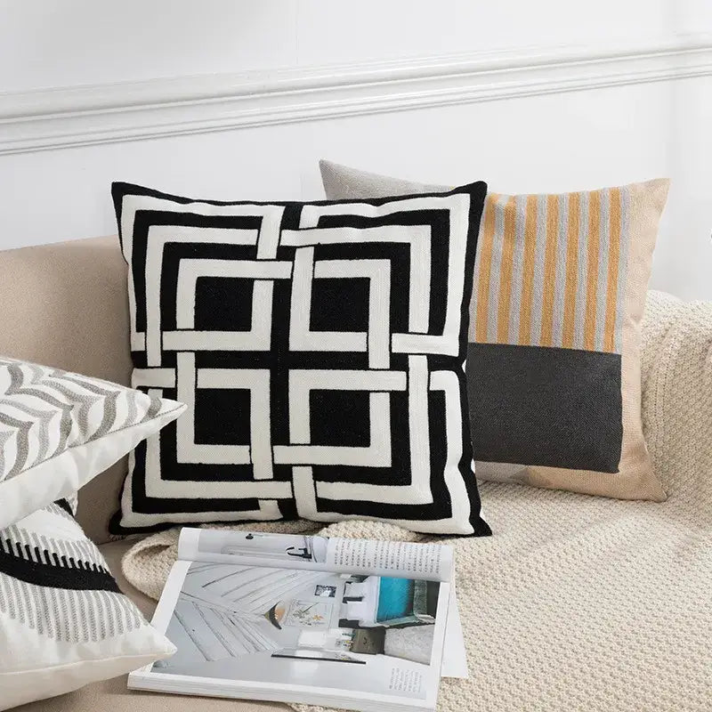 Black and white geometric embroidery cushion cover with bold interlocking square design for living room decorbites decor