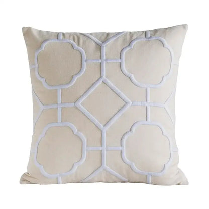 Cream-colored cushion cover with white quatrefoil and diamond geometric embroidery for yellow and teal decorbites decor