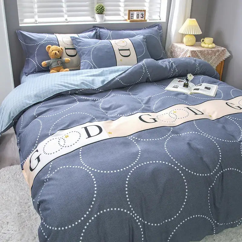 Blue duvet cover set with white dotted circles and cream bands featuring god lettering for decorbites geometric floral bedding set
