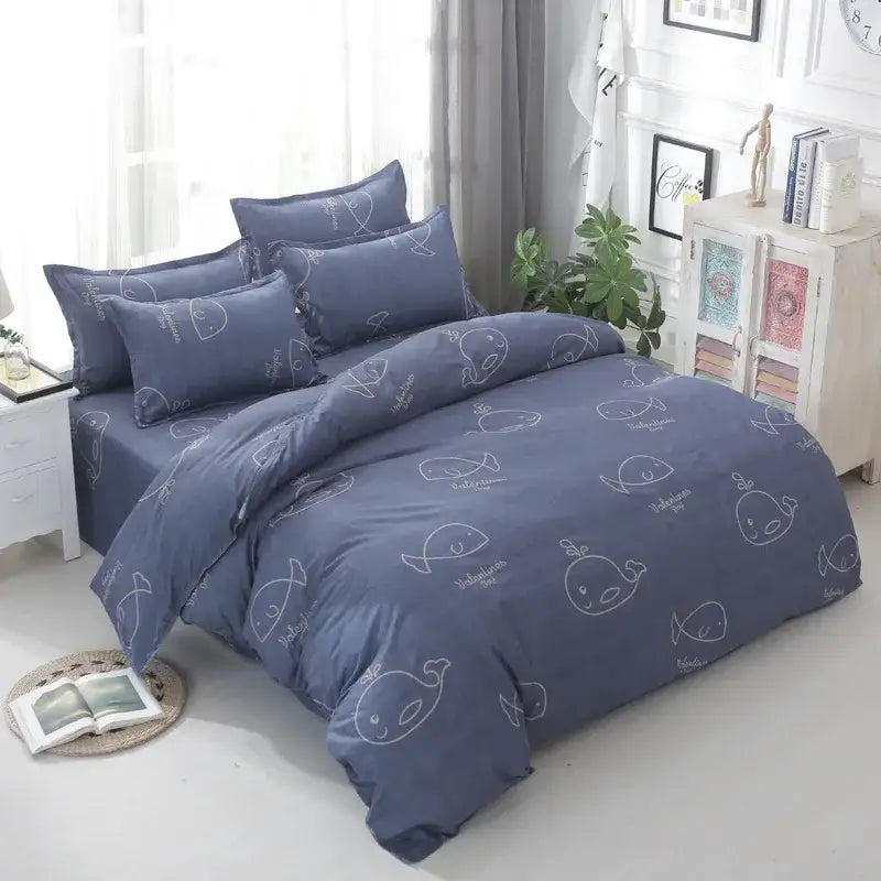 Navy blue whale-patterned bedding set with white line drawings and text accents in decorbites geometric floral bedding collection