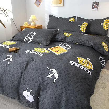 Black queen-themed bedding set with bold yellow and white crown motifs on dark gray fabric by decorbites geometric floral