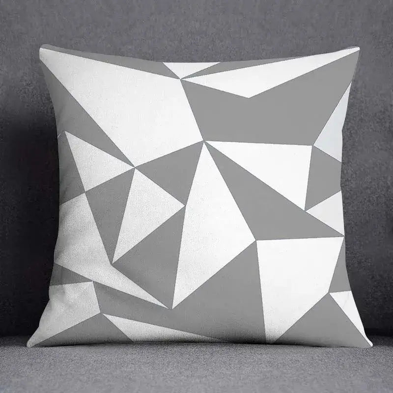 A square pillow case with a decorbites geometric floral print of white and gray triangles for living room decor