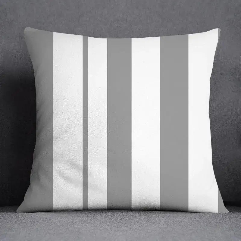 A square pillow case with vertical white and gray stripes featuring decorbites geometric floral print for living room decor