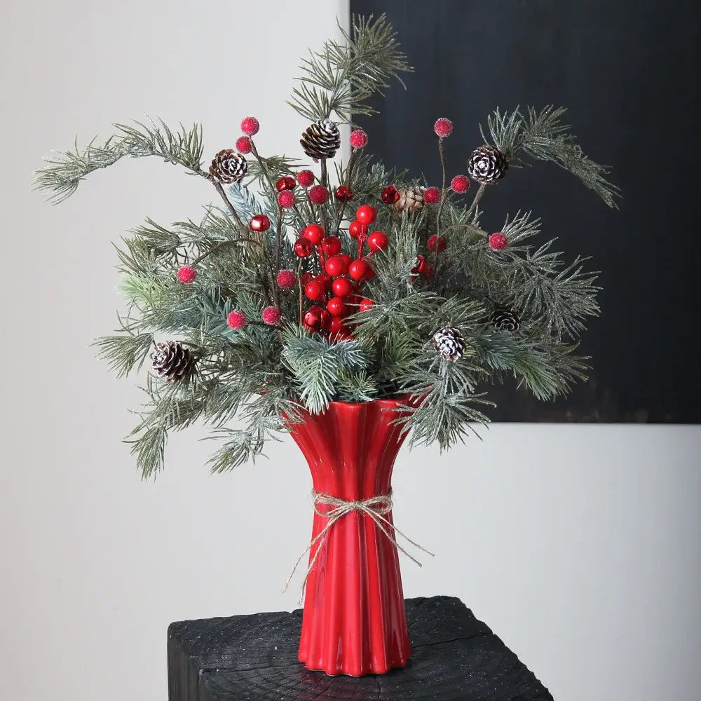 Vibrant red ceramic vase with geometric fold pattern fluted sides and rustic twine wrap for living room decor