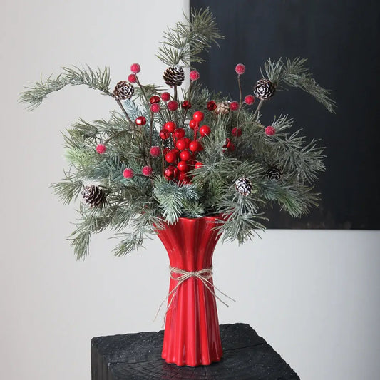 Vibrant red ceramic vase with geometric fold pattern fluted sides and rustic twine wrap for living room decor