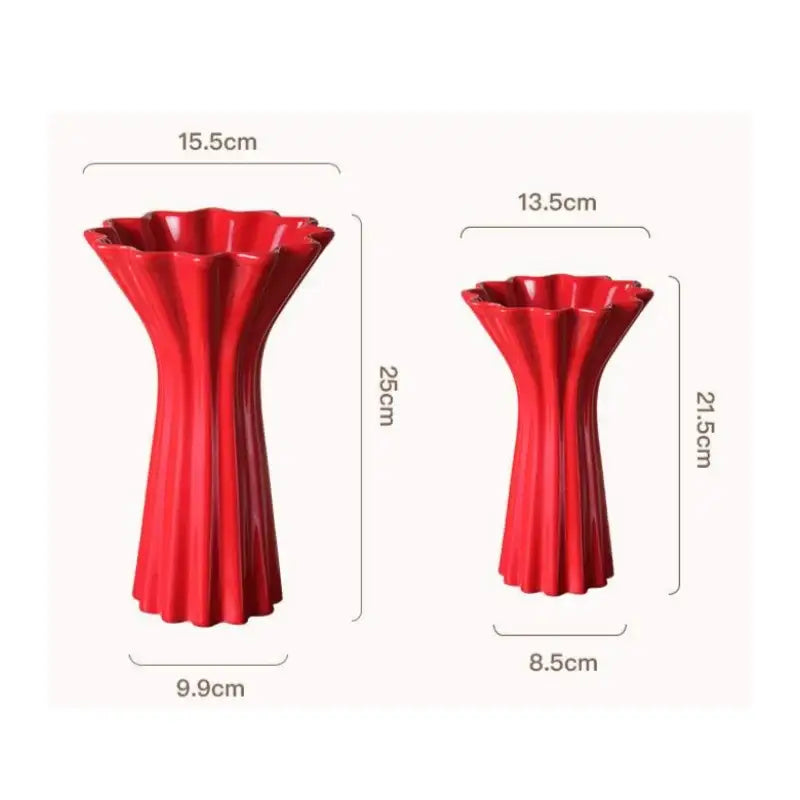 Vibrant red ceramic vases with geometric fold pattern and twine, ideal for living room decor