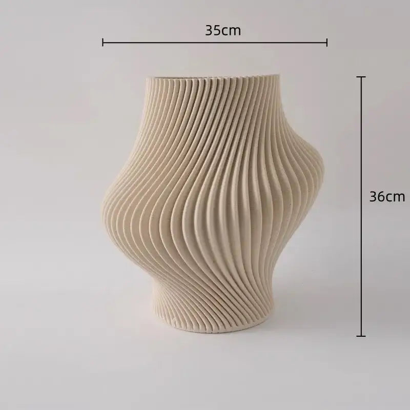 Cream-colored ceramic vase with geometric folding ribbed design and organic curves for living room decorbites geometric folding decor