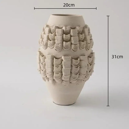 Cream-colored geometric folding ceramic vase with textured wave-like ridges for decorbites geometric folding decor