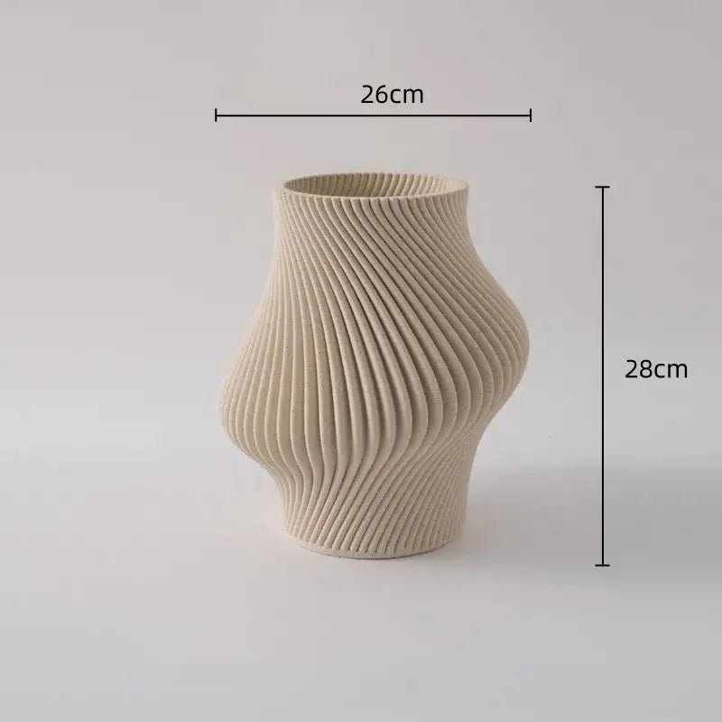 Cream-colored geometric folding ceramic vase with ribbed wavy texture and elegant curved form for living room decorbites decor