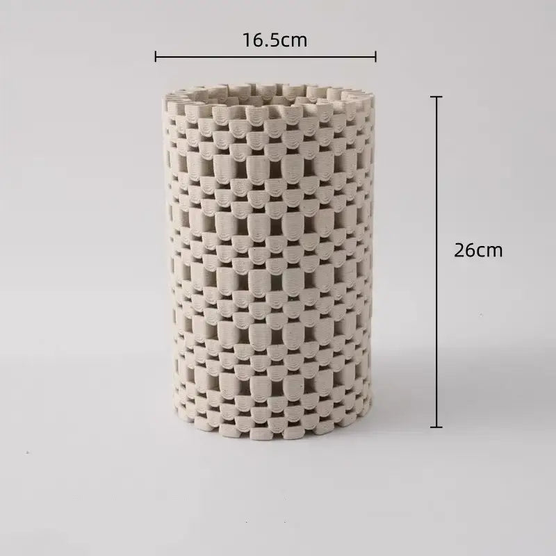 A tall beige ceramic vase with a woven lattice geometric folding design for decorbites geometric folding decor