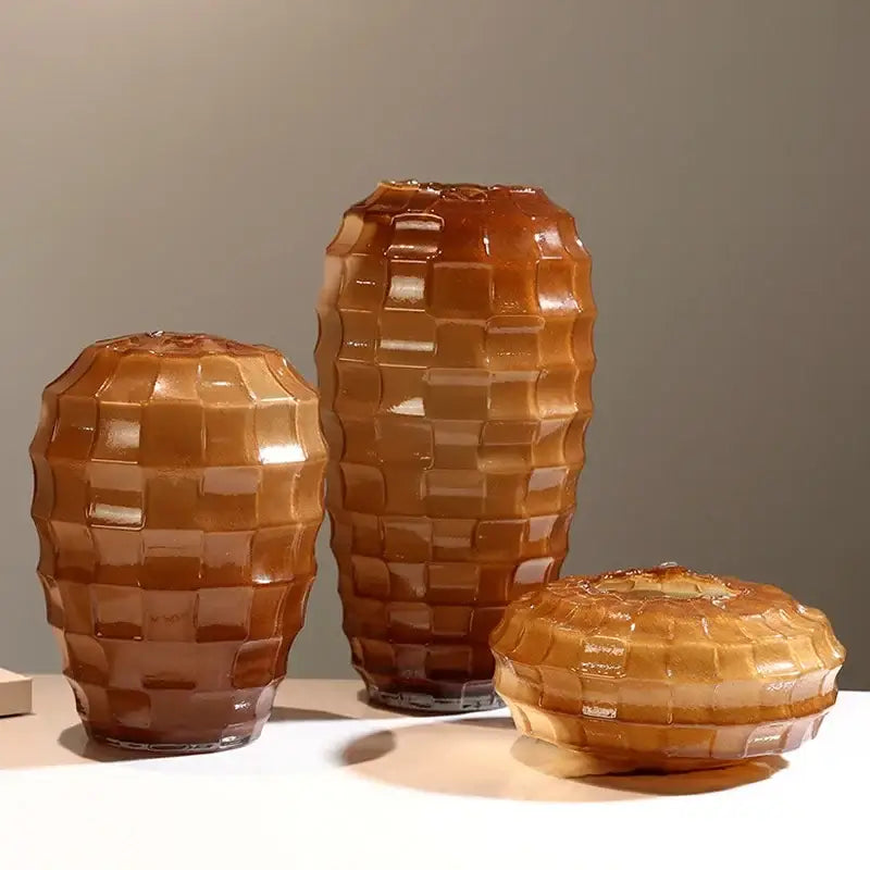 Set of three amber-toned geometric frosted glass vases with a textured woven pattern for living room decor