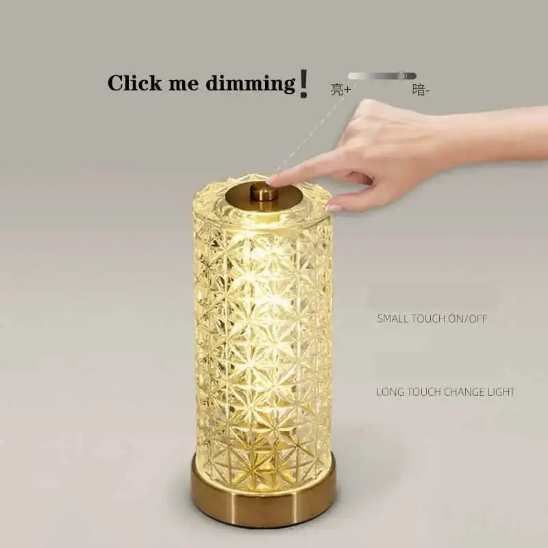Gold-toned decorbites crystal table lamp with intricate geometric cut-out patterns and brushed brass base for living room