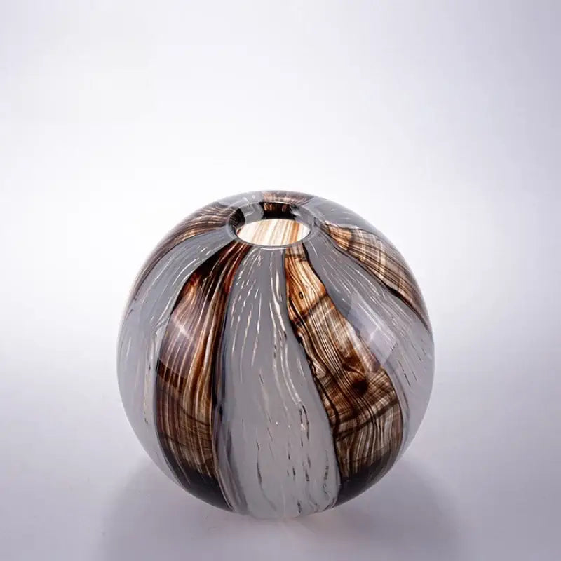 A spherical decorbites geometric glass flower vase with swirling brown gray and translucent white for living room decor