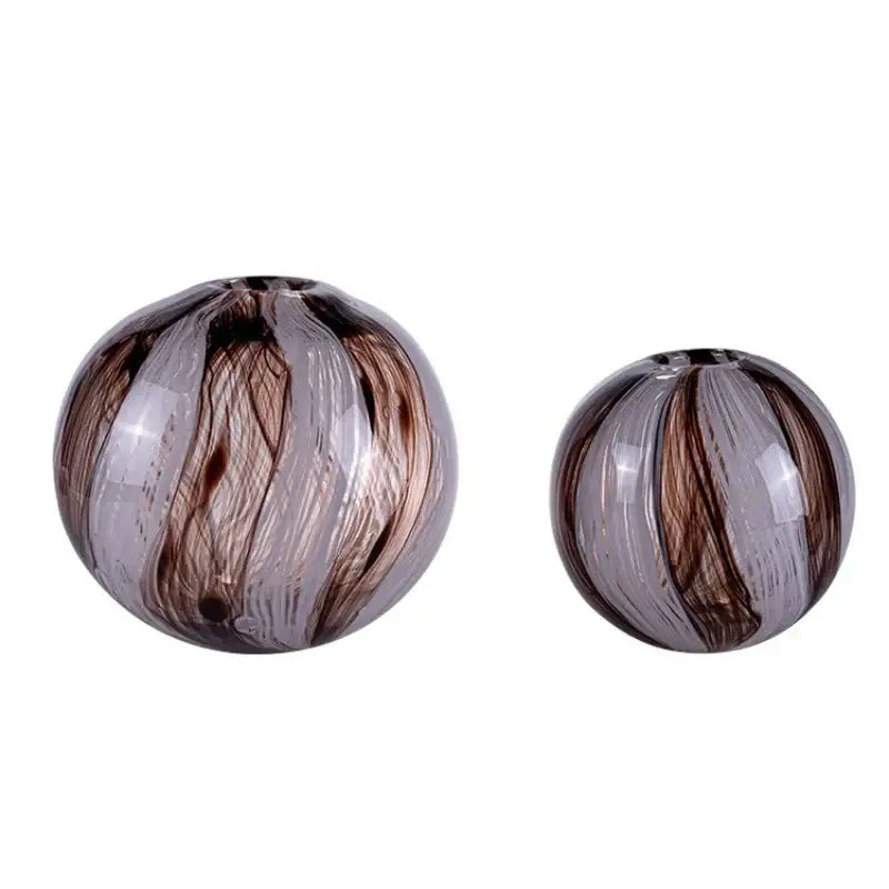 Two spherical glass flower vases with swirling brown and translucent gray patterns for geometric glass decorbites living rooms