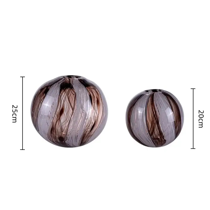 Two spherical glass flower vases in brown and clear with swirling patterns for living room decorbites geometric glass display