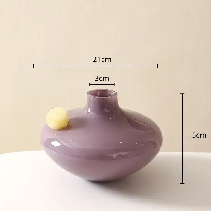 A smooth glossy lavender glass sphere vase with rounded body and narrow neck for decorbites geometric glass trio decor
