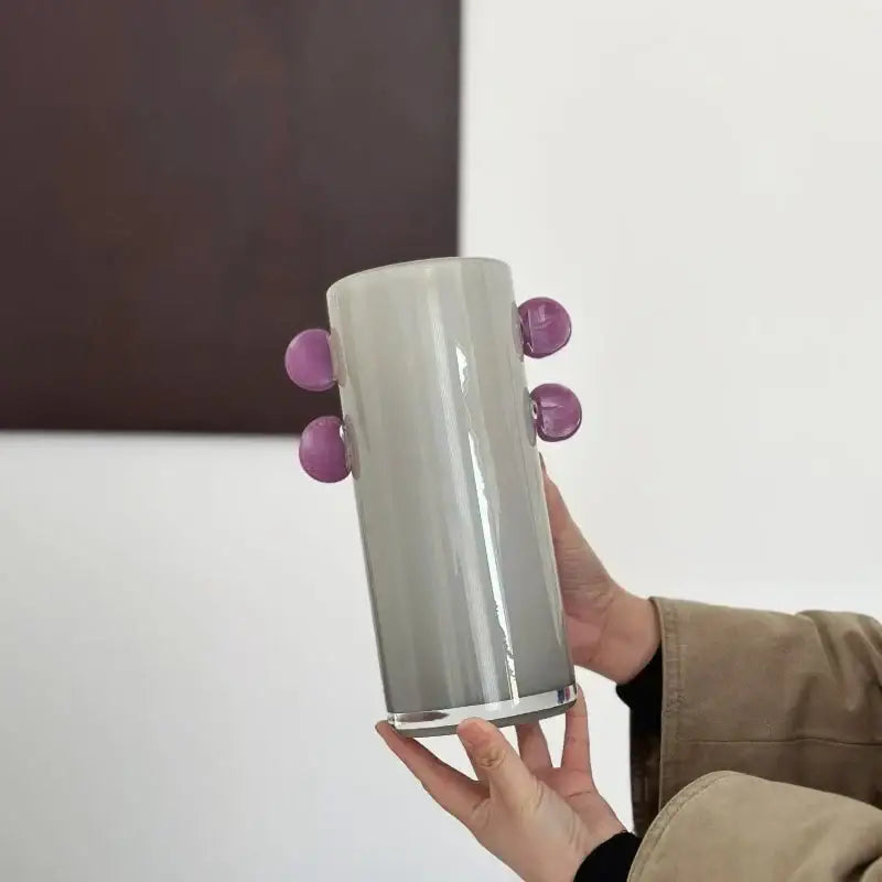 A sleek gray geometric glass vase with purple color patches and glossy accents for decorbites living room decor