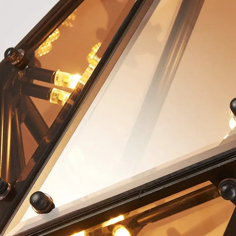 Black-framed geometric gold diamond glass led pendant lights with amber-tinted panels and filament bulbs for dining room