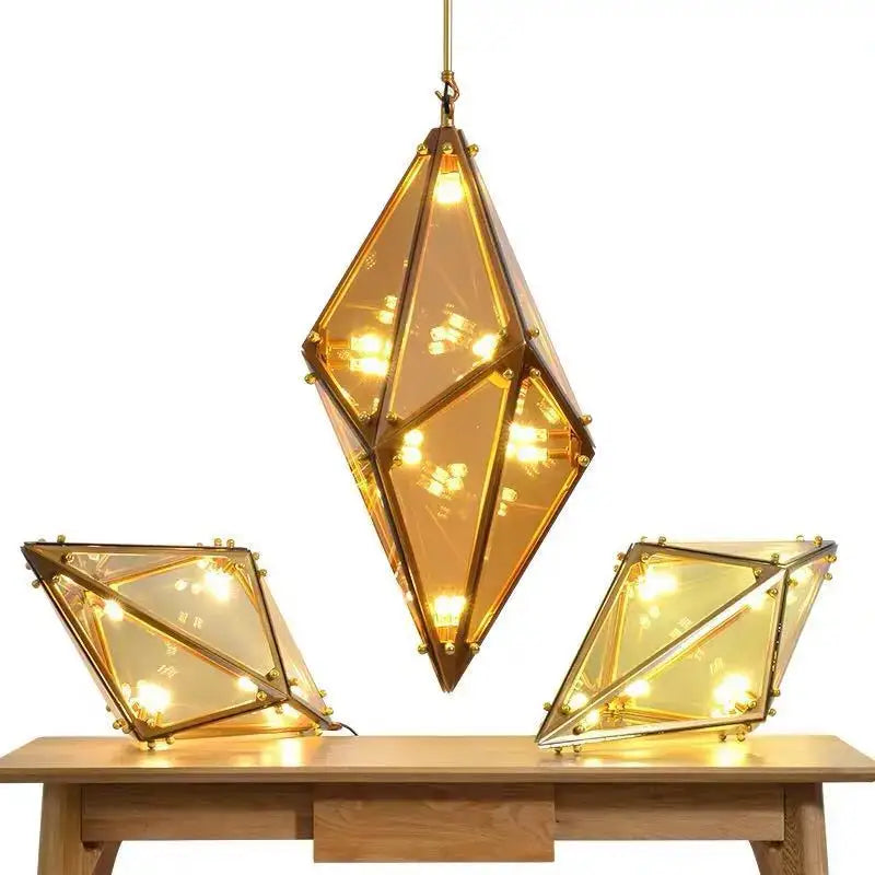 Geometric gold diamond led pendant lights with amber glass panels and brass accents for dining room lighting