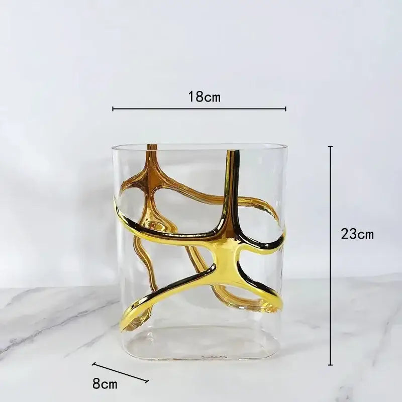 Clear glass vase with intricate gold and black metallic swirls as decorbites gold-edged glass vase for living room decor
