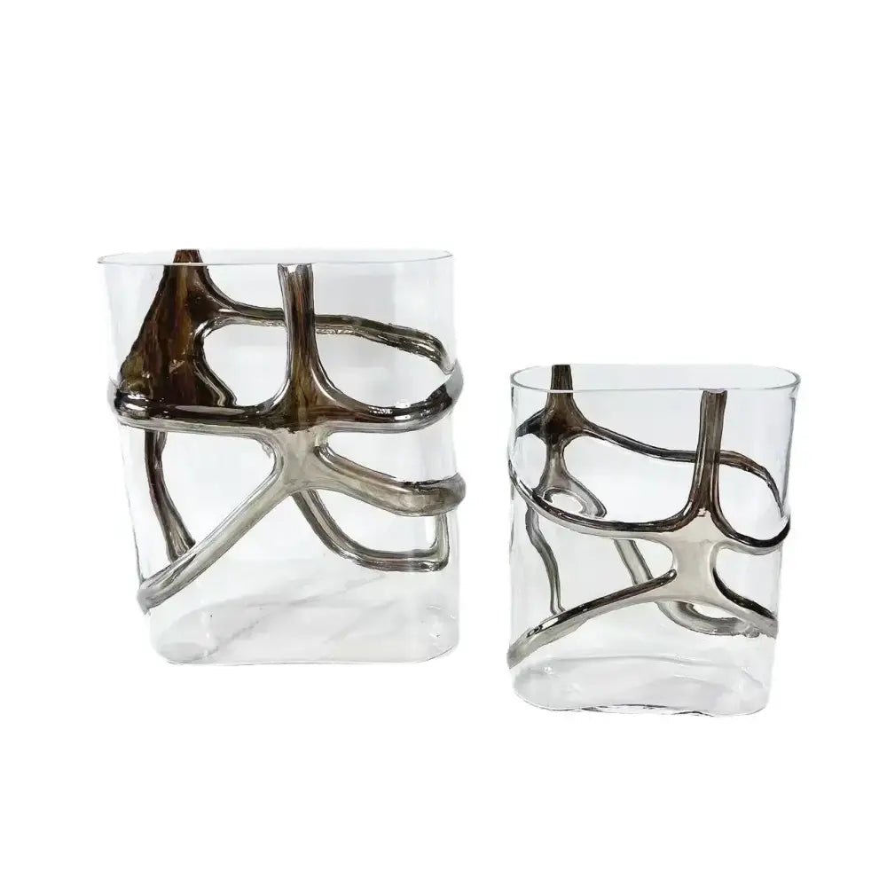 Clear glass vase with intricate silver-toned metal bands in an abstract design decorbites gold-edged glass vase decor