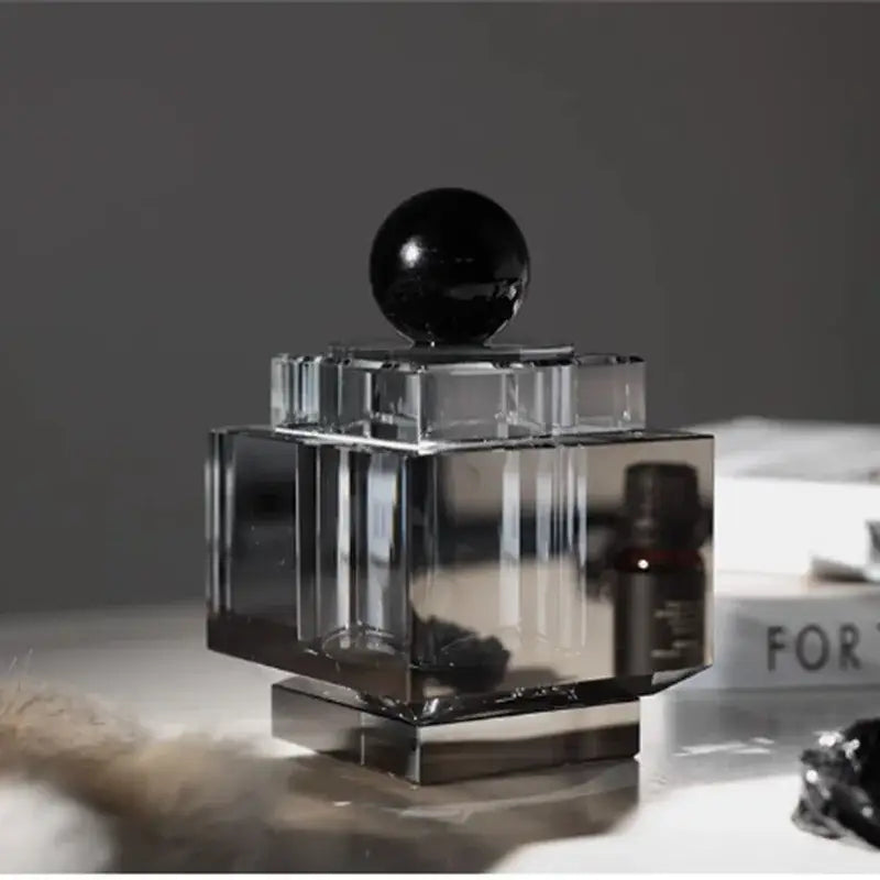 Clear crystal storage jar with faceted geometric design and glossy black stopper for bedroom decor storage jar
