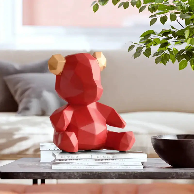 Red geometric bear figurine resin sculpture with gold ears for living room decor featuring glossy finish