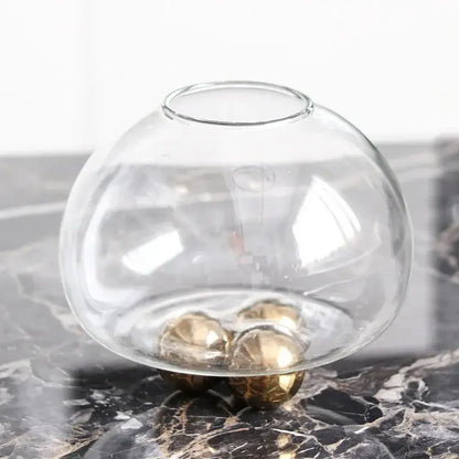 Clear glass spherical vase with three golden metallic feet for decorbites geometric golden ball living room decor
