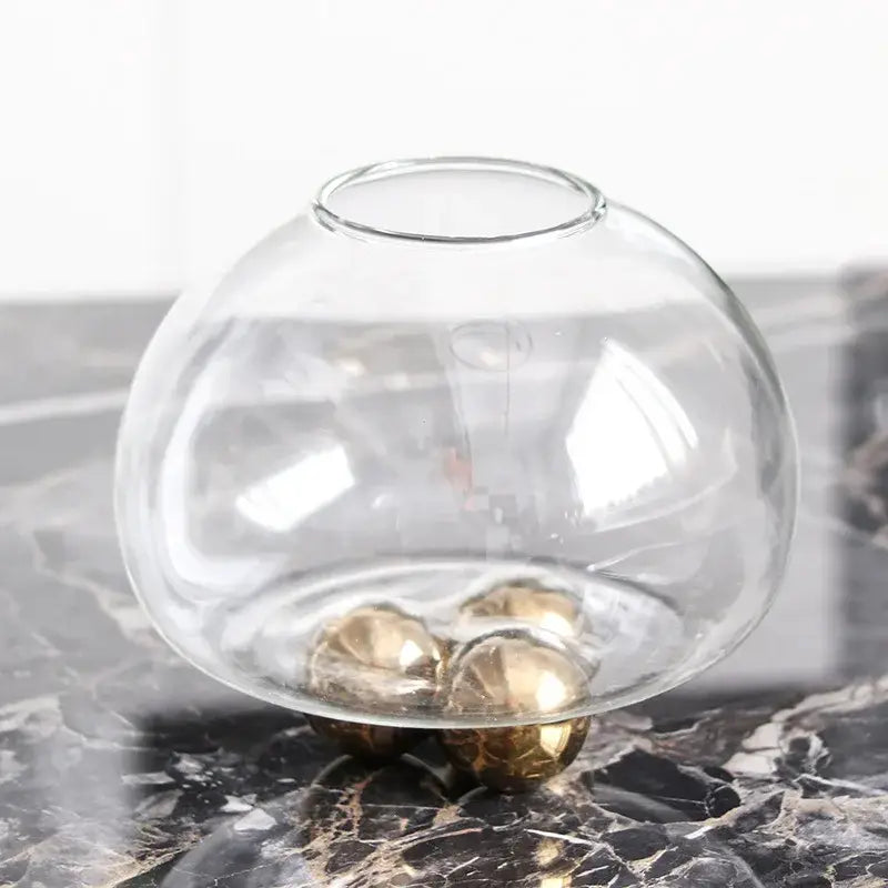 Clear glass spherical vase with three golden metallic feet for decorbites geometric golden ball living room decor