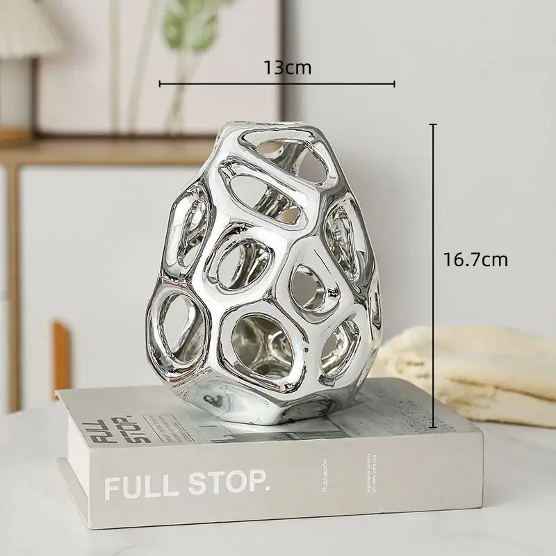 Shiny silver ceramic sculpture with geometric honeycomb design for decorbites geometric golden hollow living room decor
