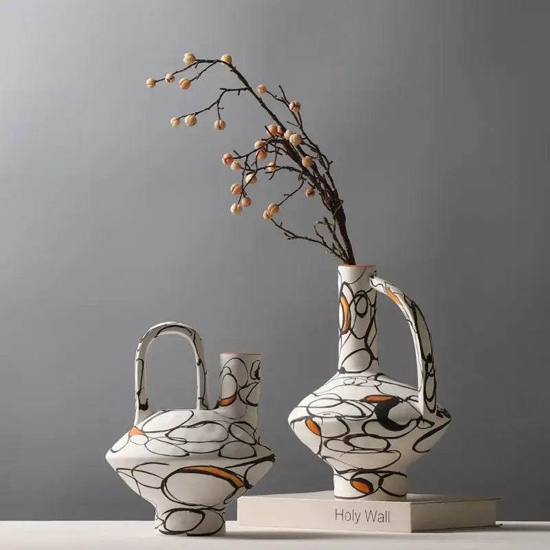 White ceramic geometric graffiti ceramic vases with black and orange patterns for terracotta living room decor