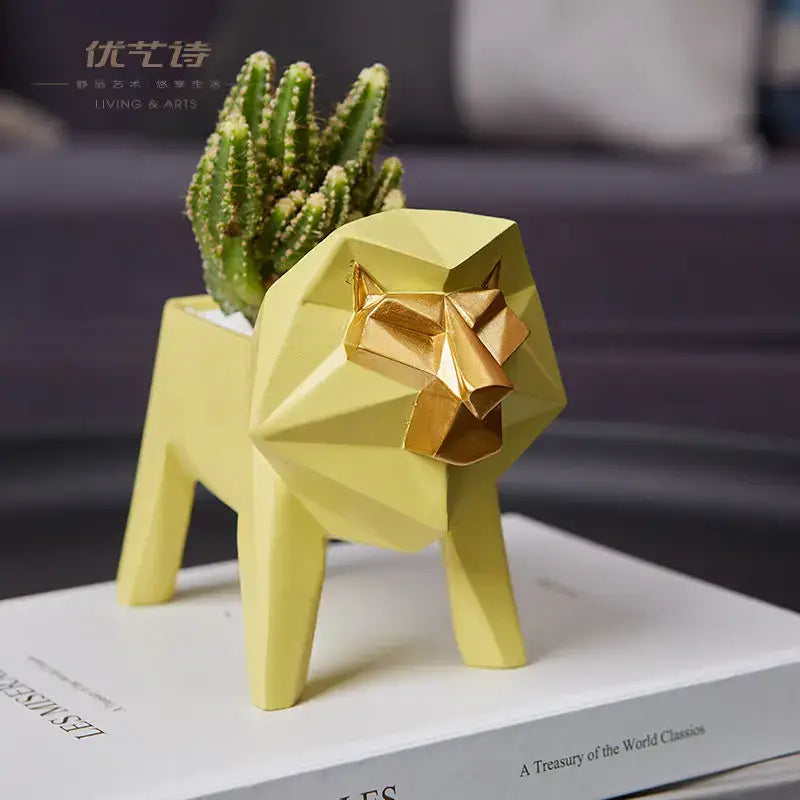 Yellow geometric lion-shaped planter with gold face holding green cactus in decorbites giraffe 3d papercraft living room decor