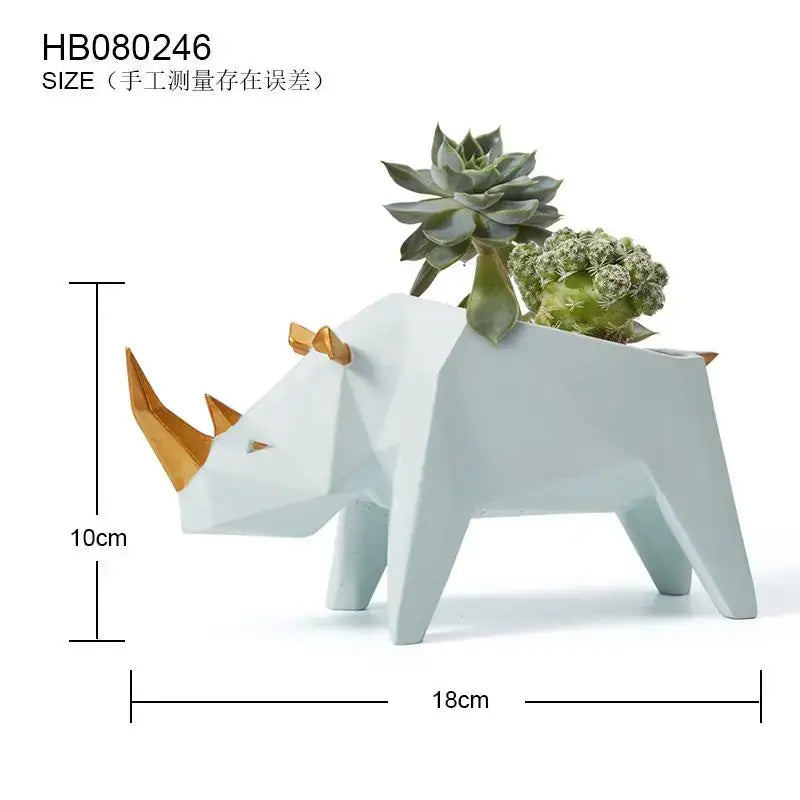 Minimalist white and gold geometric rhinoceros planter with succulents paired with decorbites giraffe 3d papercraft sculpture