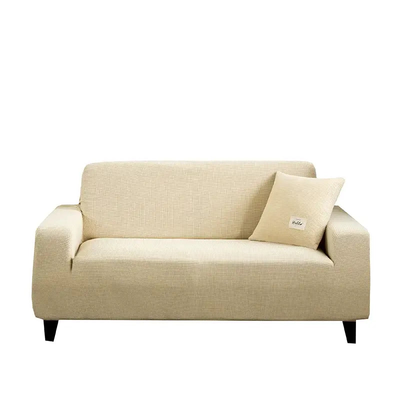 Beige textured fabric sofa cover with matching pillow complementing geometric gray textured stretch design for living room