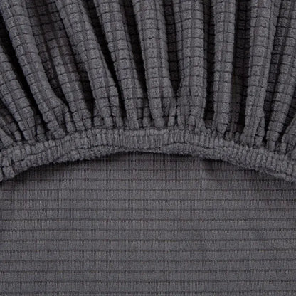 Dark gray stretchy corduroy bed skirt with ribbed texture and elasticized hem for geometric gray textured sofa cover