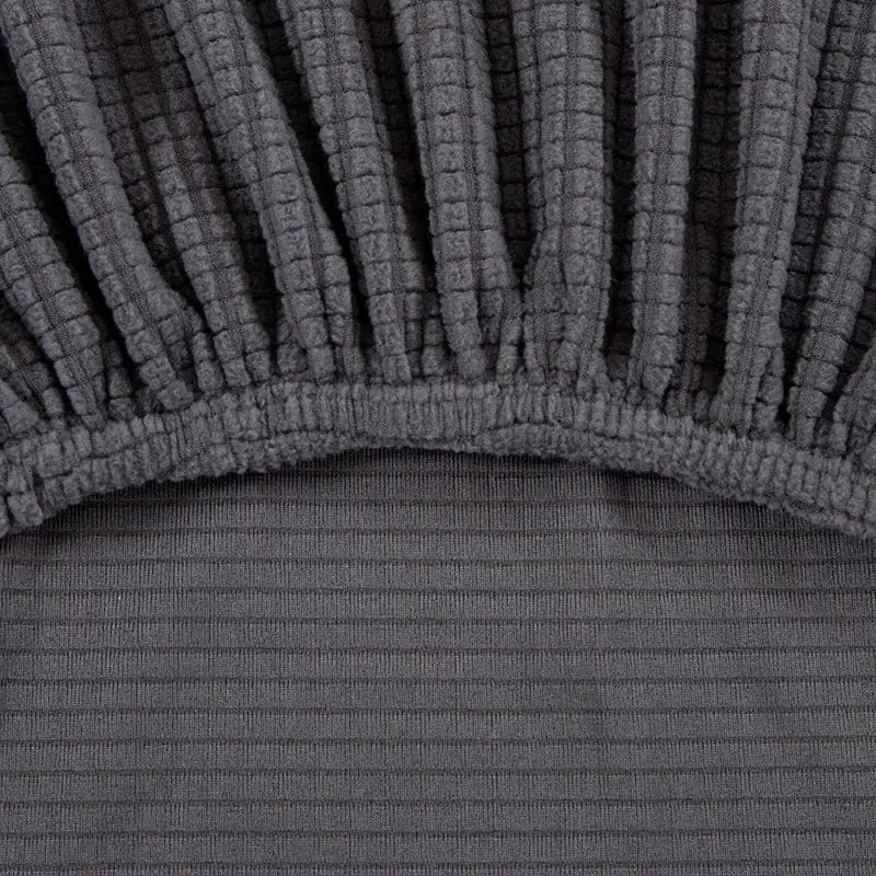 Dark gray stretchy corduroy bed skirt with ribbed texture and elasticized hem for geometric gray textured sofa cover