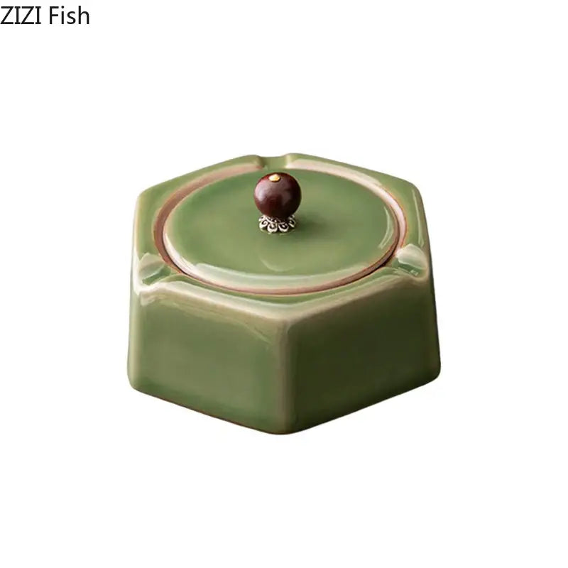 Geometric green ceramic ashtray with lid featuring a dark brown knob with silver filigree for office desk decorbites decor