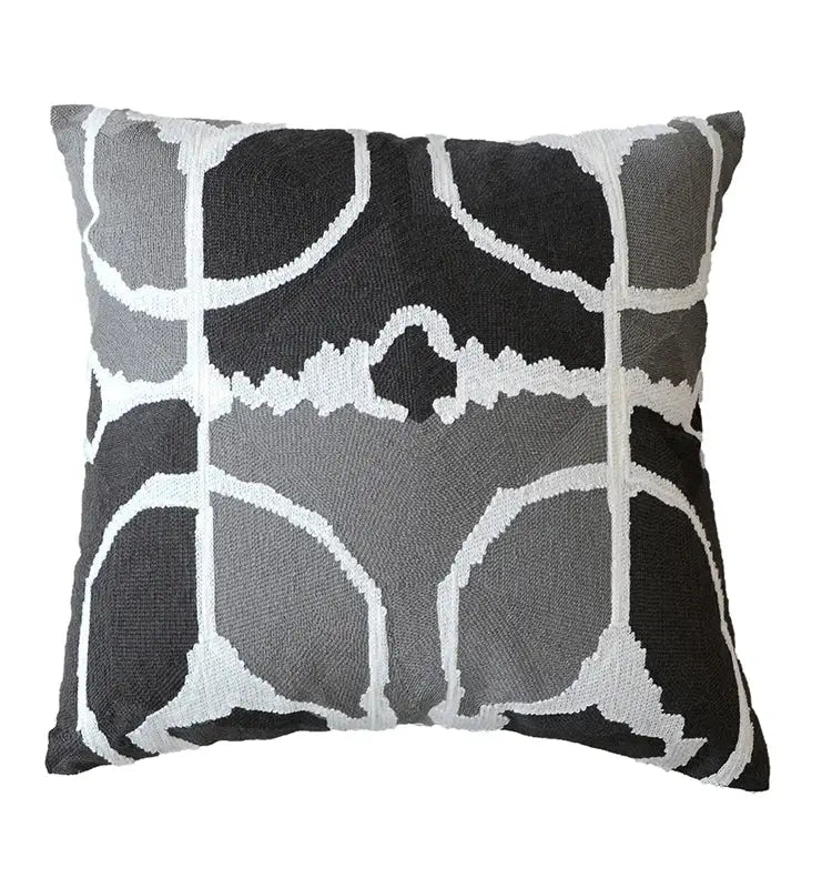 Square throw pillow with bold black gray and white abstract geometric pattern on grey embroidered cotton pillow cover decorbites