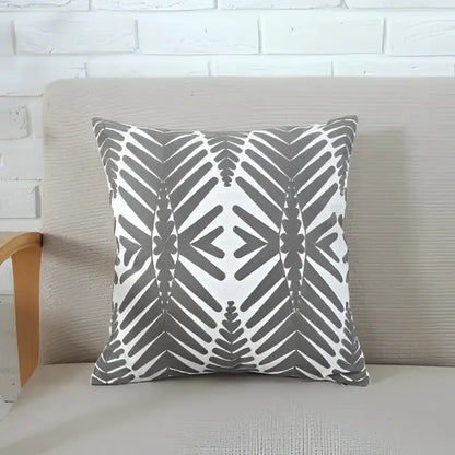 Gray and white geometric patterned cushion cover with a modern symmetrical design for decorbites grey pink living room decor