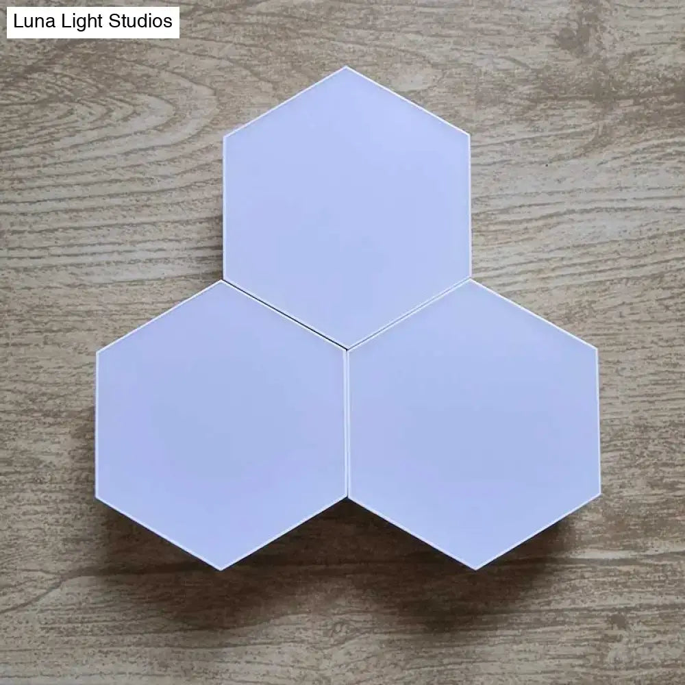 White geometric hexagon led wall lights arranged in a triangular pattern with bluetooth app control and remote control features