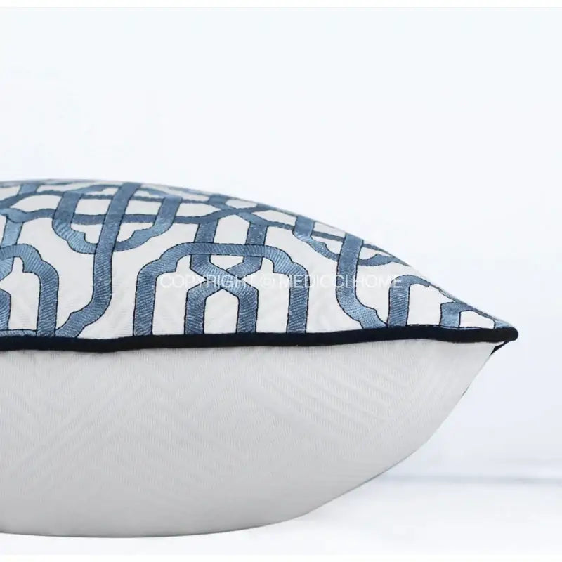 White embroidered pillow cover with blue geometric embroidery and black piping for decorbites indigo blue living room decor