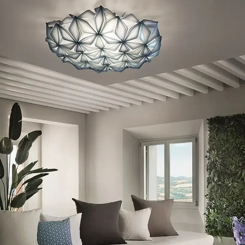 Modern ceiling light with geometric italian design featuring translucent white and gray glass petals for dining room decorbites