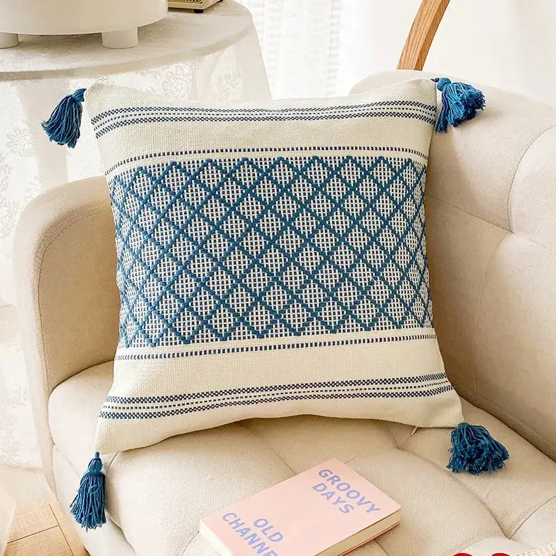 Cream-colored cushion cover with blue diamond jacquard woven design and tassels for living room decorbites blue diamond decor