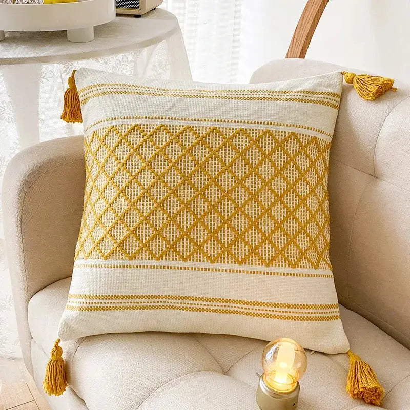 Cream-colored cushion cover with mustard-yellow diamond embroidery and tassels ideal for decorbites blue diamond decor