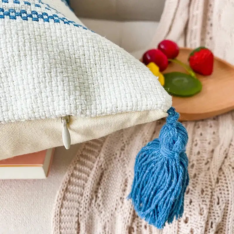 White woven cushion cover with blue diamond jacquard embroidered border and matching tassel for living room decorbites decor