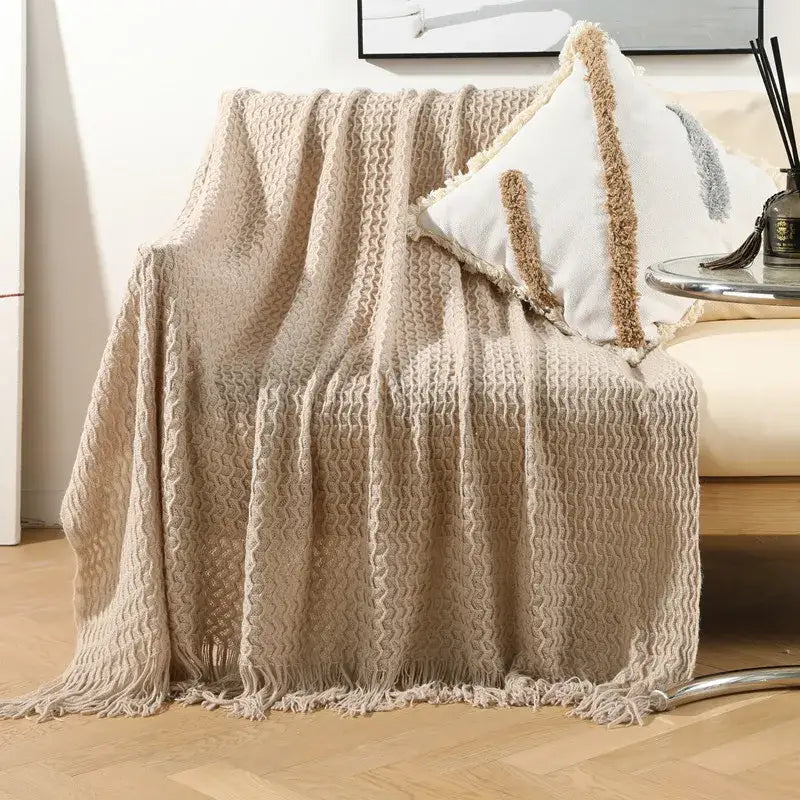 Beige textured knit sofa blanket with fringed edges and cozy woven pattern for geometric knit decorbites throw